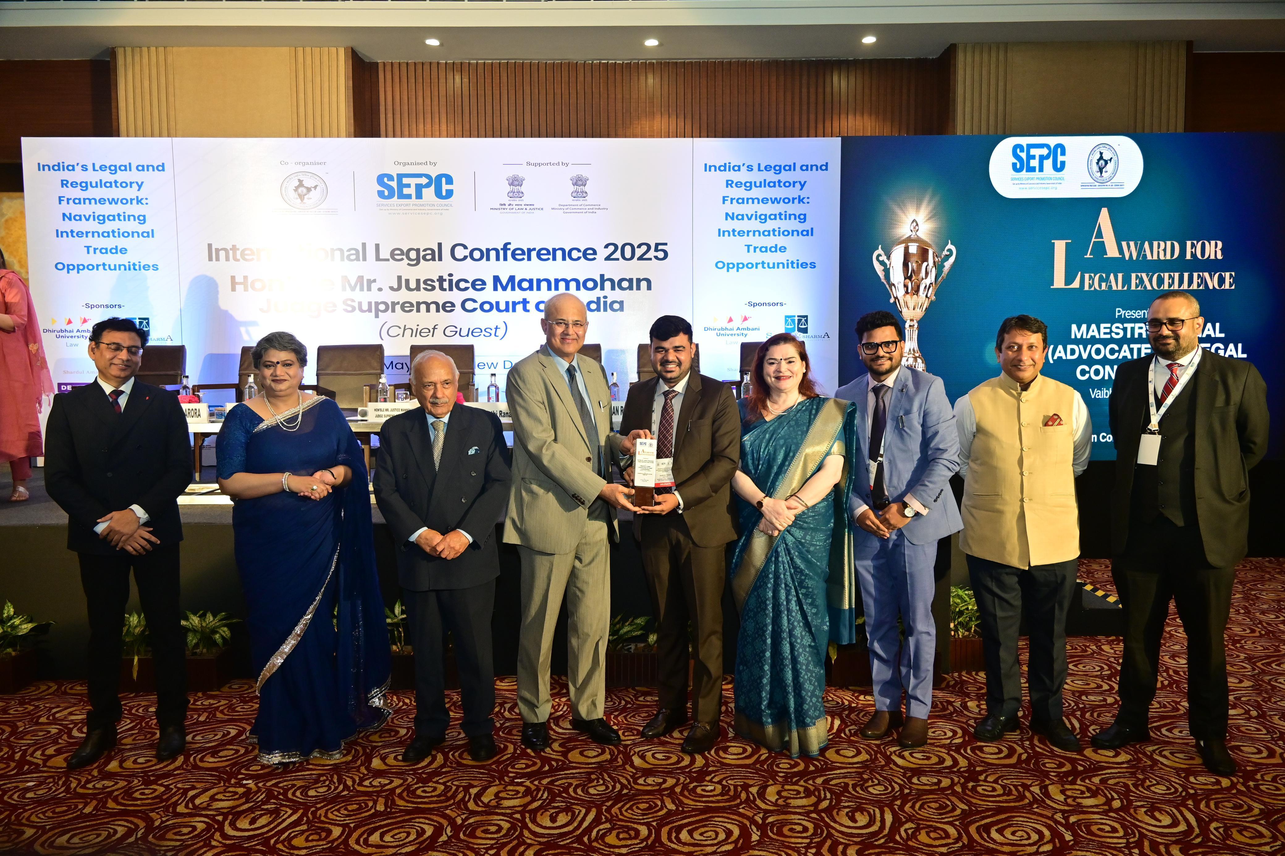 Receiving an excellence award on stage